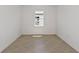 This room features tile flooring and a single window, offering natural light and a clean, modern design at 4471 Sw 84Th Street Rd, Ocala, FL 34476