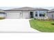 Beautiful single-story home featuring a three car garage, freshly cut lawn, and meticulously maintained landscaping at 4471 Sw 84Th Street Rd, Ocala, FL 34476