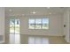 Bright living room featuring tile floors and large windows flooding the space with natural light at 4471 Sw 84Th Street Rd, Ocala, FL 34476