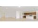Open floor plan with kitchen showcasing shaker cabinets, stainless appliances, and large island at 4471 Sw 84Th Street Rd, Ocala, FL 34476