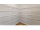 Walk-in pantry with ample shelving for optimal storage and organization at 4471 Sw 84Th Street Rd, Ocala, FL 34476
