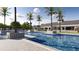 Community pool with tropical landscaping and lounge areas at 4471 Sw 84Th Street Rd, Ocala, FL 34476