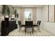 Modern dining room with round table, black chairs, and neutral decor at 1982 Sarah St, Winter Haven, FL 33884