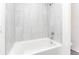 Clean bathroom with a bathtub and modern tile at 3179 Seville St, Lake Alfred, FL 33850