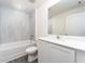 Bathroom with white cabinets and a bathtub at 3179 Seville St, Lake Alfred, FL 33850