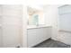 Bathroom with white cabinets and a view of another bedroom at 3179 Seville St, Lake Alfred, FL 33850