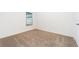 Bright bedroom with carpeted floor and a window at 3179 Seville St, Lake Alfred, FL 33850