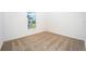 Simple bedroom with carpeted floor and a window at 3179 Seville St, Lake Alfred, FL 33850
