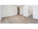 Spacious bedroom with neutral carpeting and an en-suite bathroom at 3179 Seville St, Lake Alfred, FL 33850