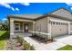 House exterior with tan siding, gray roof and walkway at 3179 Seville St, Lake Alfred, FL 33850
