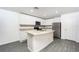 Modern kitchen with white cabinets, granite countertops and island at 3179 Seville St, Lake Alfred, FL 33850