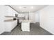 Modern kitchen with white cabinets, granite countertops and island at 3179 Seville St, Lake Alfred, FL 33850