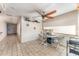 Bright dining room with tile flooring, ceiling fan and lots of natural light at 6141 Palmetto Dr, Indian Lake Estates, FL 33855