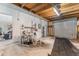 Spacious garage offers ample storage and workspace, featuring a roll-up door and access to utilities at 6141 Palmetto Dr, Indian Lake Estates, FL 33855