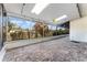 Large covered patio with stone flooring, skylights, and large windows offering an abundance of natural light at 6141 Palmetto Dr, Indian Lake Estates, FL 33855