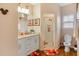 Bathroom with double vanity, shower, and Mickey Mouse decor at 3231 Cupid Pl Pl, Kissimmee, FL 34747
