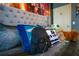 Star Wars themed bedroom with plush toys and wall art at 3231 Cupid Pl Pl, Kissimmee, FL 34747