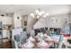Elegant dining area with glass table and seating for six at 3231 Cupid Pl Pl, Kissimmee, FL 34747