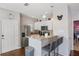 Modern kitchen with stainless steel appliances and breakfast bar at 3231 Cupid Pl Pl, Kissimmee, FL 34747