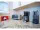 Kitchen counter with appliances and granite countertop at 3231 Cupid Pl Pl, Kissimmee, FL 34747