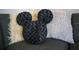 Couch with Mickey Mouse pillow and decorative pillows at 3231 Cupid Pl Pl, Kissimmee, FL 34747
