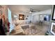 Cozy living room featuring a comfortable sectional sofa and neutral tones at 525 Waterside Pointe Dr, Groveland, FL 34736