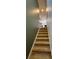 A carpeted staircase leads to the upper level of the home, offering easy access to the bedrooms and living areas at 525 Waterside Pointe Dr, Groveland, FL 34736