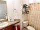 Clean bathroom with wood cabinets and shower/tub combo at 14637 Huntcliff Park Way, Orlando, FL 32824