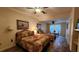 Comfortable bedroom with two twin beds and ceiling fan at 469 Blue Heron Cir # 469, River Ranch, FL 33867