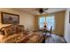 Cozy bedroom with a queen bed and a small sitting area at 469 Blue Heron Cir # 469, River Ranch, FL 33867