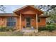 Inviting exterior of a ranch-style home with stone pathway at 469 Blue Heron Cir # 469, River Ranch, FL 33867