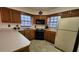 Cozy kitchen featuring wood cabinets and ample counter space at 469 Blue Heron Cir # 469, River Ranch, FL 33867