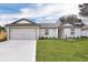Single-story house with attached garage and landscaped lawn at 15605 Sw 49Th Ave Rd, Ocala, FL 34473