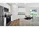 Kitchen with granite countertops and stainless steel appliances at 15605 Sw 49Th Ave Rd, Ocala, FL 34473