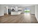 Open concept kitchen with island and stainless steel appliances at 15605 Sw 49Th Ave Rd, Ocala, FL 34473