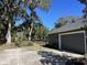 Spacious backyard with a basketball court and detached garage at 2300 Se 73Rd Loop, Ocala, FL 34480