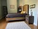 Bedroom with wood flooring, a comfortable bed and plenty of natural light at 2300 Se 73Rd Loop, Ocala, FL 34480