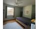 Light and airy bedroom with wood floors and a queen bed at 2300 Se 73Rd Loop, Ocala, FL 34480