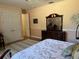 Bedroom with a double bed, dresser, and walk-in closet at 2300 Se 73Rd Loop, Ocala, FL 34480