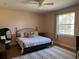 Spacious bedroom with wood floors and a king-size bed at 2300 Se 73Rd Loop, Ocala, FL 34480