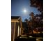 Peaceful nighttime view of the home's exterior under the moonlight at 2300 Se 73Rd Loop, Ocala, FL 34480