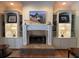 Elegant fireplace with built-in shelving and a large mantle at 2300 Se 73Rd Loop, Ocala, FL 34480