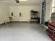Attached garage with epoxy floors and ample storage at 2300 Se 73Rd Loop, Ocala, FL 34480