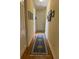 Long hallway with hardwood floors and a runner rug at 2300 Se 73Rd Loop, Ocala, FL 34480