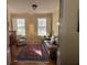 Bright living room with hardwood floors, comfy seating, and large windows at 2300 Se 73Rd Loop, Ocala, FL 34480