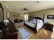 Large main bedroom with a king-size bed and sitting area at 2300 Se 73Rd Loop, Ocala, FL 34480
