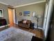 Bright home office with leather couch and hardwood floors at 2300 Se 73Rd Loop, Ocala, FL 34480