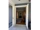 Access to the living area from a covered patio with French doors at 2300 Se 73Rd Loop, Ocala, FL 34480
