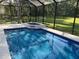 Refreshing pool with a built-in spa and screened enclosure at 2300 Se 73Rd Loop, Ocala, FL 34480