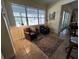 Cozy sitting area with leather chairs and large windows at 2300 Se 73Rd Loop, Ocala, FL 34480